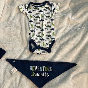 This is a swiggles dinosaur onesie. With a matching bib.